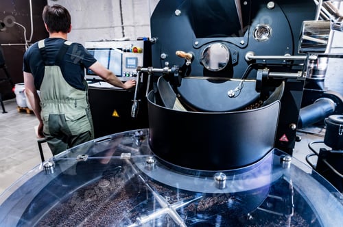 Preview: Coffee pouring from roaster machine to cooling cylinder.