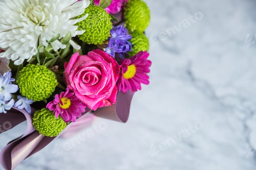 Preview: Bouquet of varied flowers.bouquet of colorful chrysanthemums, roses and gypsophila. traditional gift