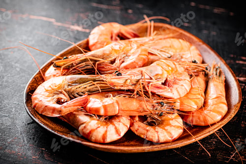 Preview: Boiled shrimp in a wooden plate.