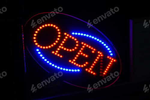Preview: Neon light in window of eating establishment notifying customers they are open for business.