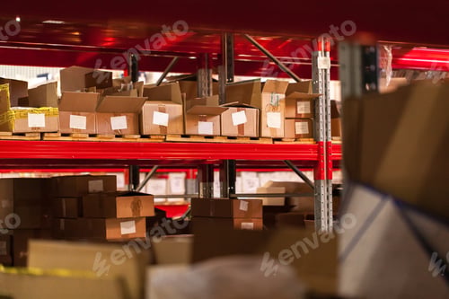 Preview: Modern warehouse shelves with pile of cardboard boxes
