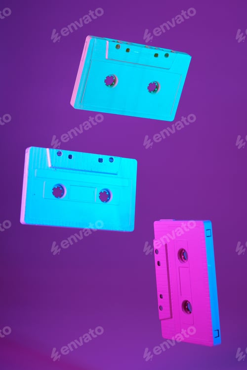 Preview: Cassette tape vintage style suspended in air on purple background