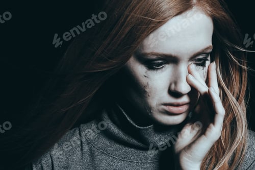 Preview: Beautiful woman covering tears
