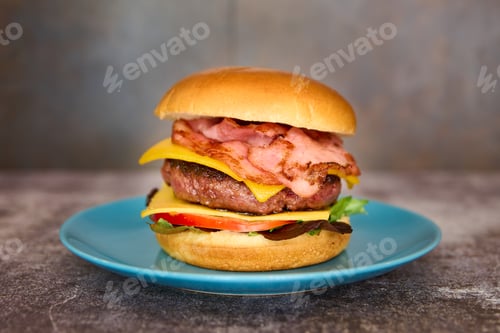 Preview: burger with cheddar cheese, caramelized onion, tomato and fries