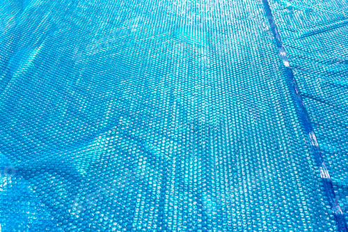 Preview: A large expansion pool with a diameter of 3.96 m, set in the yard next the house with a solar mat.