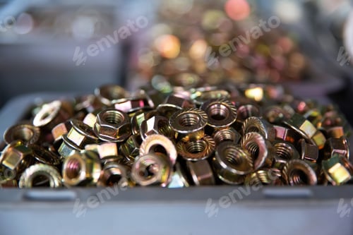 Preview: Closeup of metall nuts abstract industrial background