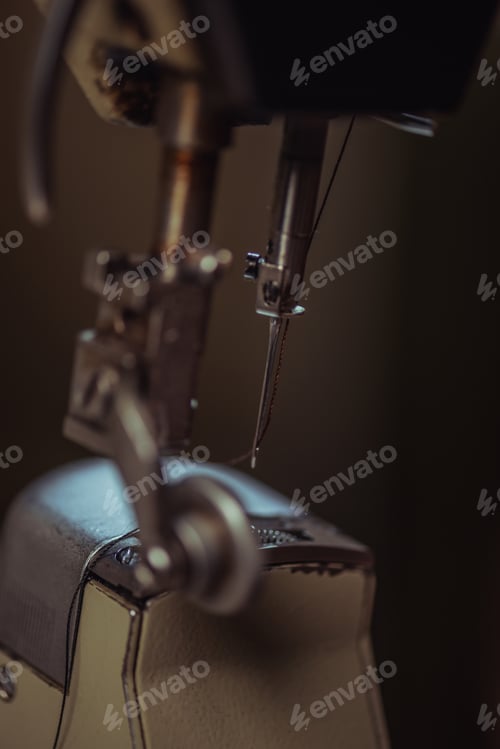 Preview: selective focus of needle of sewing machine in workshop