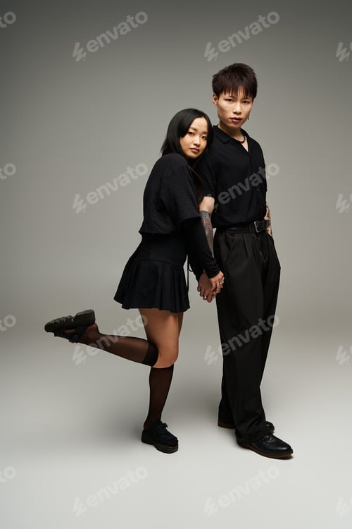 Preview: Stylish couple embracing love in trendy attire, exuding romance and confidence in a modern setting