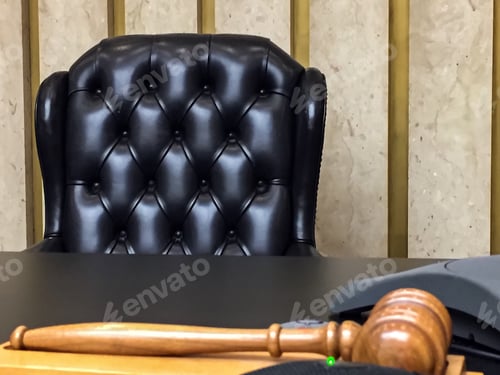 Preview: Courtroom view of the bench with gavel and judge’s seat - a time for justice in the legal system