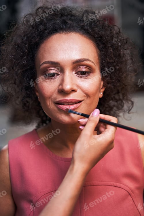 Preview: Close up of pretty female doing makeup