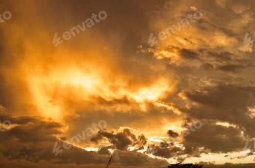 Preview: Foreboding yellow orange clouds at sunset.