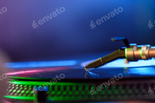 Preview: close up view of sound mixer with vinyl in nightclub