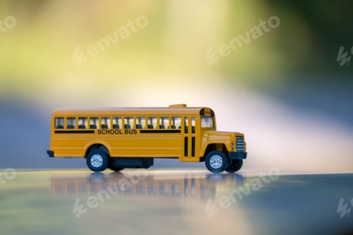 Preview: Small model of american yellow school bus as symbol of education in the USA