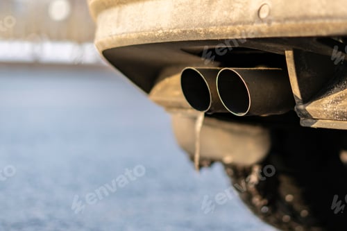 Preview: close up exaust pipe of a car releasing gas b
