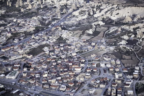 Preview: Aerial shot of town near a mountainous landscape