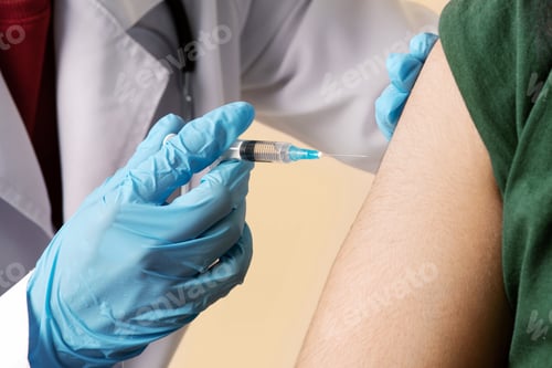 Preview: Woman doctor making intramuscualr injection for arab guy at clinic