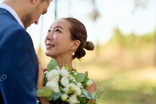 Preview: Bride and Groom Celebrating Love Outdoors on Wedding Day