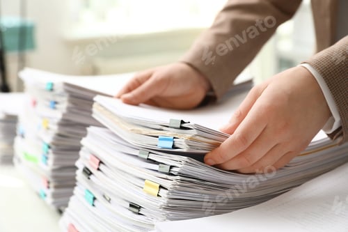 Preview: Woman working with documents at table in office, closeup