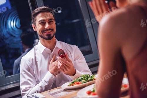 Preview: Man proposing in restaurant