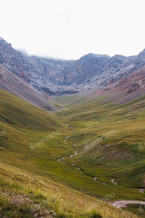 Preview: Vertical view of a winding river in a mountain valley