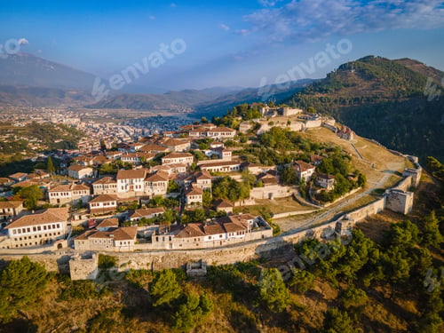 Preview: Aerial view of the old Castle in Berat and its ancient neighborhoods in sunset light