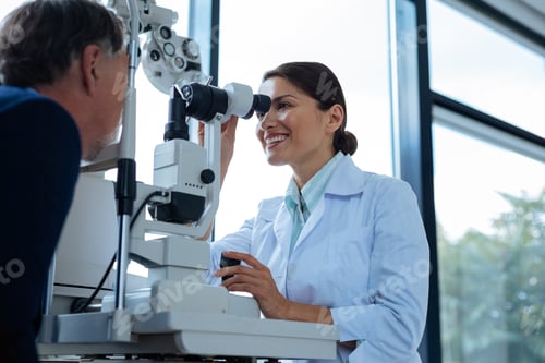 Preview: Medical Professional Examines Patient's Eyes with Slit Lamp