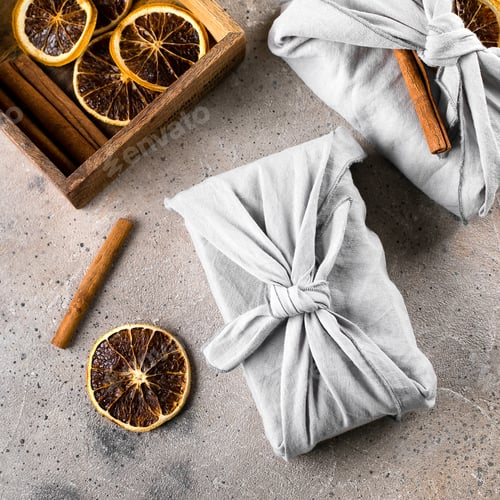 Preview: Holiday eco-friendly fabric reusable gift packaging with dry orange and cinnamon. Zero waste concept