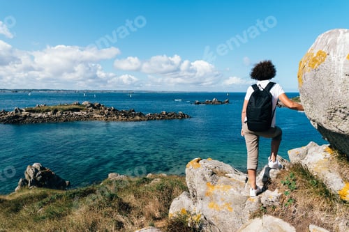 Preview: Rear view of middle-aged woman hiking