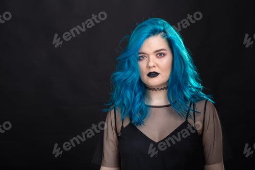 Preview: people, fashion and hair concept - close-up portrait of young woman in black dress with blue hair on