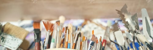 Preview: Assortment of various art tools including brushes and palette knives