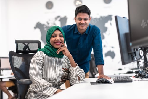 Preview: Multiethnic startup business team woman wearing a hijab on meeting in modern open plan office