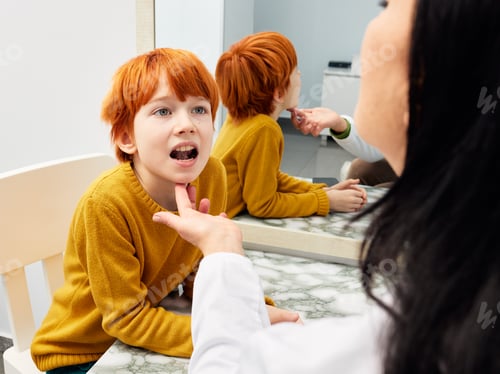 Preview: Male child in session with a speech therapist. Paediatric speech and language therapy