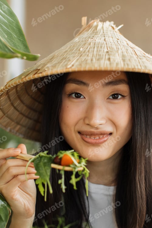 Preview: Asian Woman Eating Salad