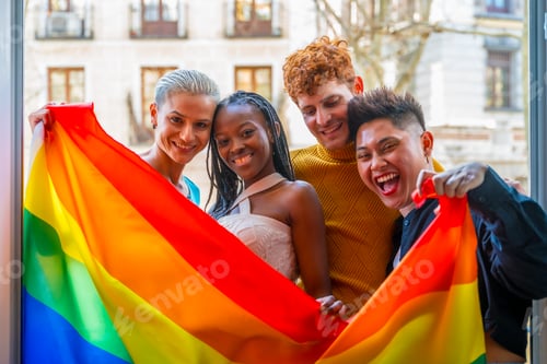 Preview: Lgtb couples of lesbian gay boys and girls in a portrait with rainbow flag