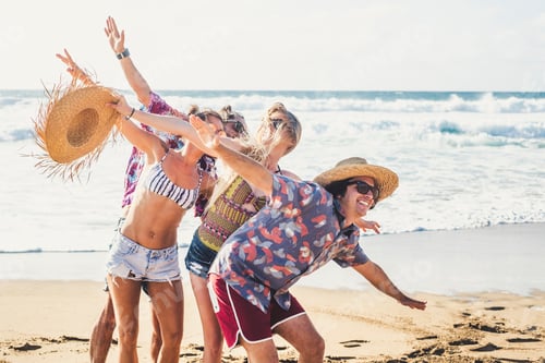 Preview: Summer style group of young cheerful people together having fun and laughina a lot in holiday