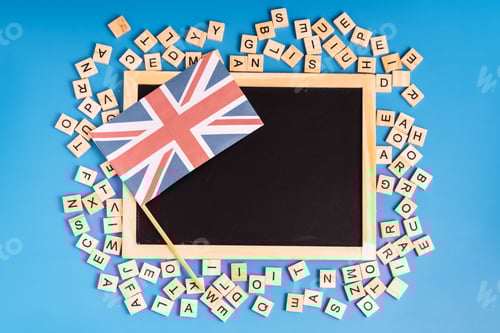 Preview: Chalk board with british flag and latin letters on blue background