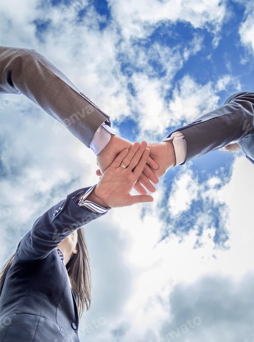 Preview: Business team showing unity with hands together