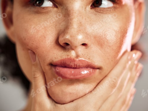 Preview: Face, freckles and woman in studio fo skincare, thinking and makeup, cosmetics and grooming or hygi