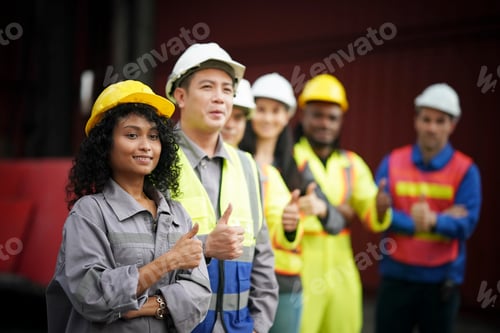 Preview: Team of construction workers celebrating safety at a job site during the day