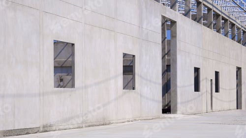Preview: concrete wall structure with roof beam of incomplete factory building in construction site