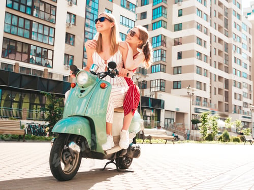 Preview: Two young beautiful woman posing outdoors