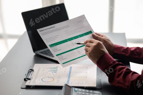 Preview: Business men are looking at the company's financial documents to analyze problems and find solutions