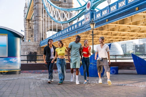 Preview: Multiracial group of happy young friends bonding in London