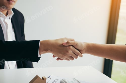 Preview: Home sales agents and buyers work on signing new homes and shaking hands.
