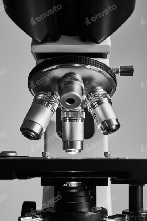 Preview: Modern microscope with metal lens at laboratory.