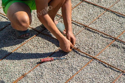 Preview: Knitting metal reinforcement for a swimming pool. Selective focus.