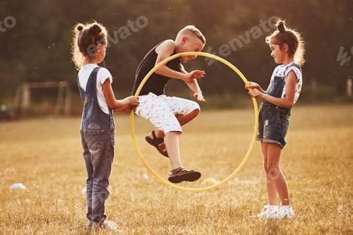 Preview: Jumping through the circle fitness tool. Kids having fun in the field