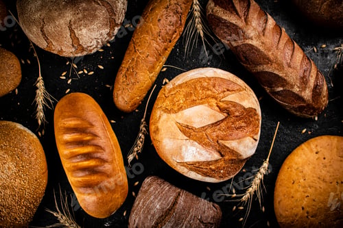 Preview: Different types of fresh bread on the table.