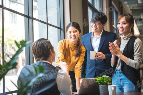Preview: A group of business people celebrating the joy of business success