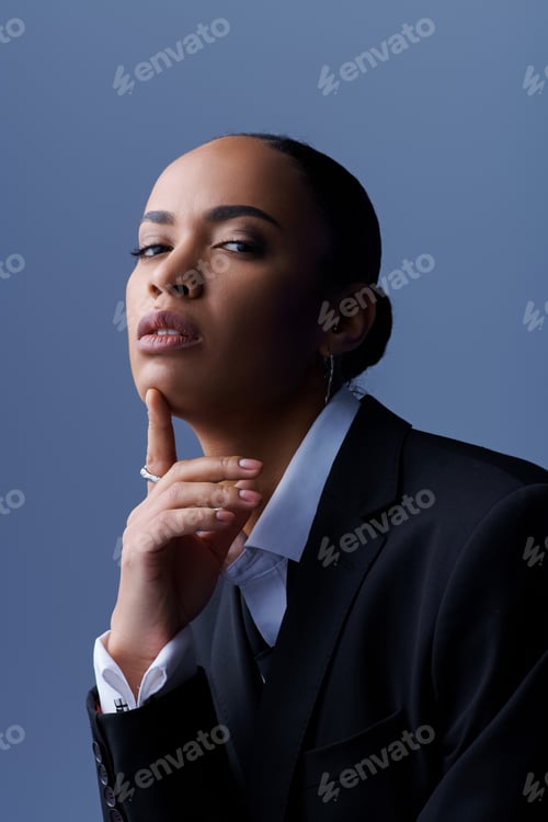 Preview: Elegant vision: captivating young businesswoman strikes pose